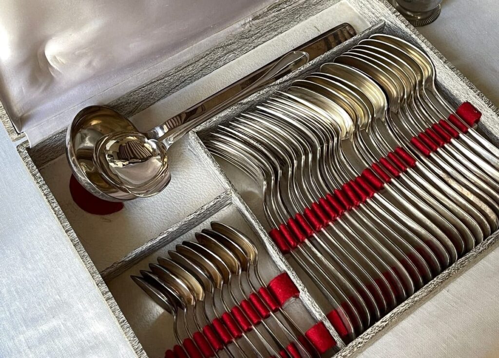A classic vintage silver cutlery set displayed in an elegant box, perfect for fine dining.
